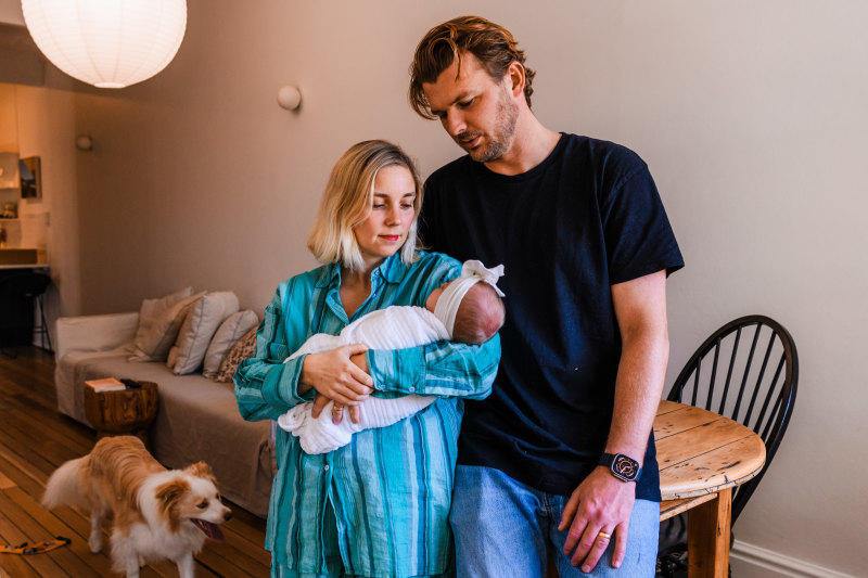 Tom Parish, his wife Kristy and their daughter Kaia. The family cut back on spending and refinanced their home loan as interest rates rise.