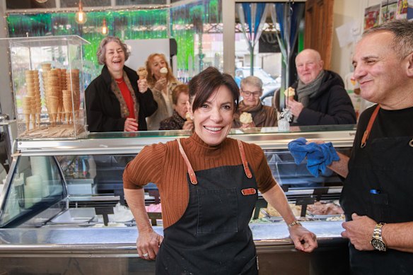 Yumbos ice cream in Carlton North is closing. Toni Romeo, with colleague Brett Costa, and customers including Amanda Atkins, Diane Davidson and Paul Ekers.