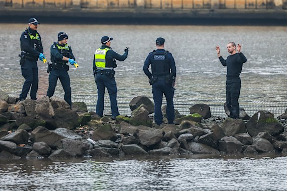 Jack Gibson-Burrell surrenders to police after he descended from the Bolte Bridge.