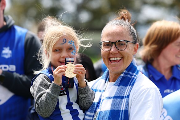 Emma Kearney celebrates the premiership with North Melbourne fans.