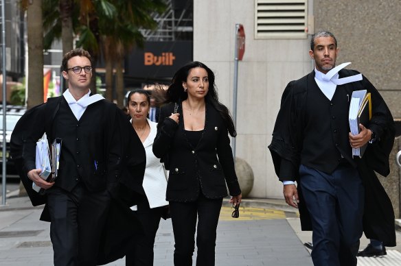 Antoinette Lattouf arrives at the Federal Court in Sydney on Wednesday, flanked by her barristers Philip Boncardo (left) and Oshie Fagir (right).