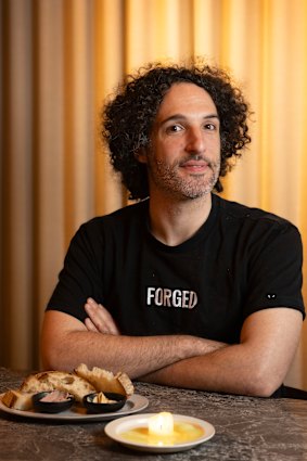 Vow CEO and founder George Peppou with some Forged parfait and a quail tallow candle.