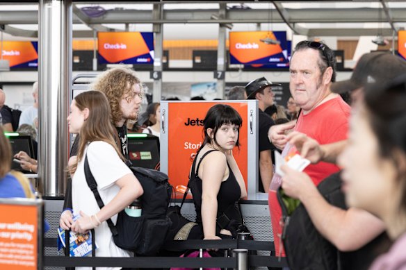 Long check-in lines at Sydney Airport as a global Airbus recall grounds planes.