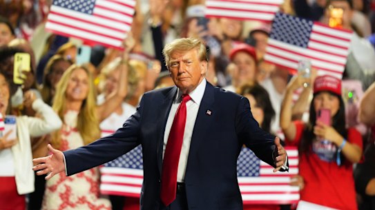 Donald Trump on stage for night two of the Republican midterm convention, where attendees recited a pledge to “the greatest president in the history of the United States”.