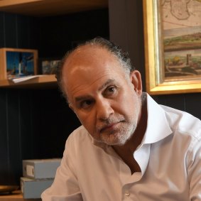 Mark Mezrani, owner of Kidstuff, works in his office in Glebe.