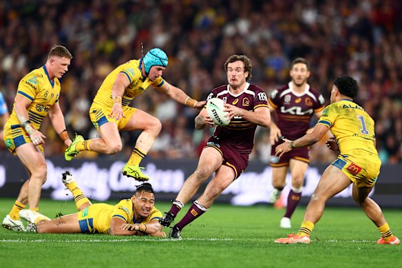 Kobe Hetherington makes a break to score his try against the Eels at Suncorp Stadium.
