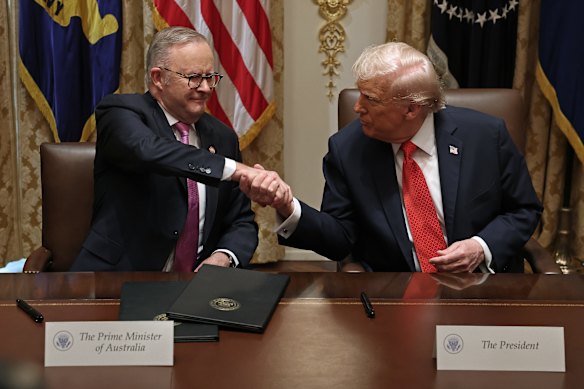 Anthony Albanese and Donald Trump shake hands after signing an $8.5 billion minerals agreement.