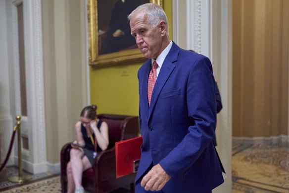 Senator Thom Tillis walks to the chamber at the Capitol earlier this month.