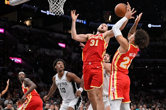 Jock Landale (No.31) leaps for a rebound.
