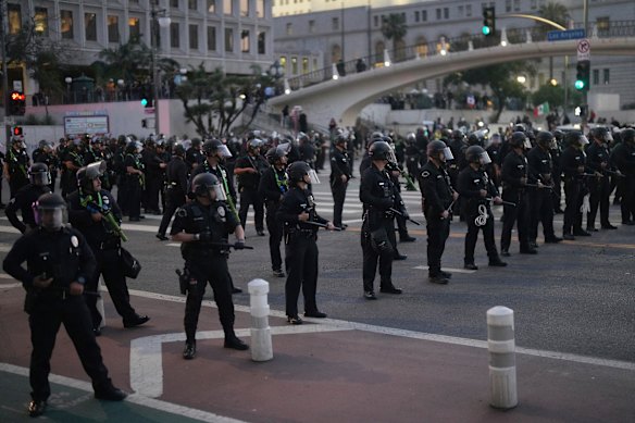 Police blocked off streets as night fell and the curfew descended upon downtown Los Angeles.