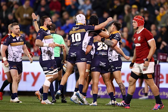 Hudson Creighton of the Brumbies celebrates scoring a try,