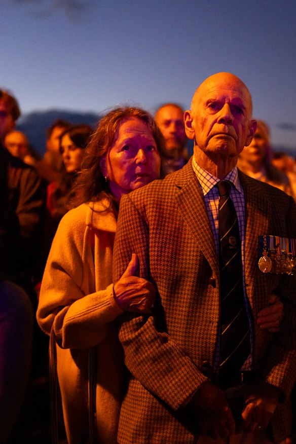 Tony White, who was a frontline doctor in the Vietnam War, is joined by his wife, Doffy White at the Coogee Anzac Day dawn service.