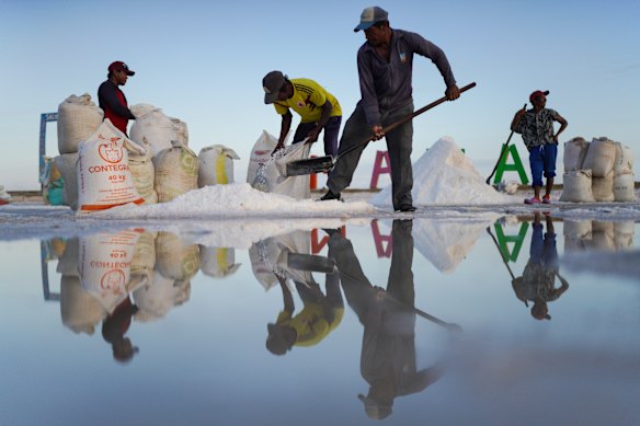 Workers harvest salt at ponds in Manaure, Colombia.