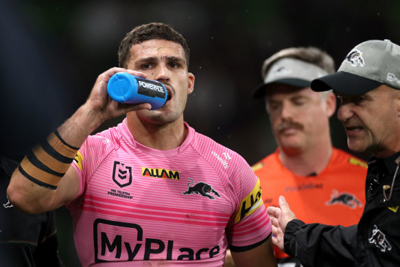 Nathan Cleary is assisted from the field after suffering the concussion.