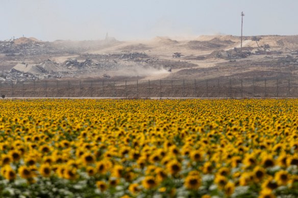 The Gaza Strip is seen from a sunflower field on the Israeli side of the border, in southern Israel, on Monday.