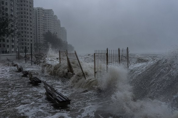 Strong waves crash against the waterfront in Hong Kong’s Heng Fa Chuen area as Super Typhoon Ragasa approaches the city.