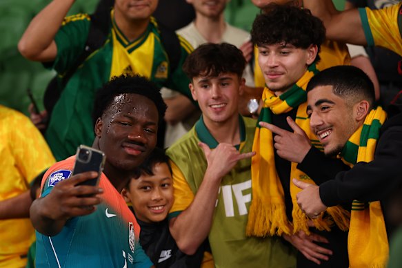 Nestory Irankunda poses with fans after the friendly against Curacao.
