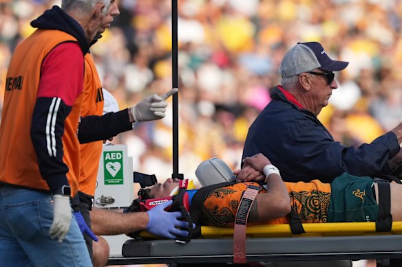 Australia’s Noah Lolesio leaves the field after a heavy tackle against Fiji in Newcastle