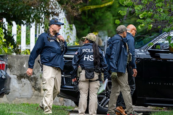Homeland Security officers leave the Washington residence of Democratic congresswoman Ilhan Omar.