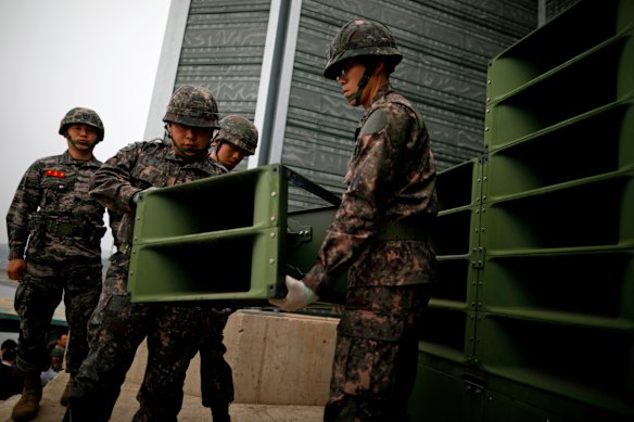 South Korean soldiers in 2018 with loudspeakers used to broadcast propaganda and K-pop into North Korea from the border. In August, South Korea began dismantling its speakers to ease tensions.