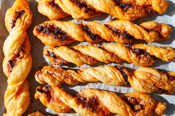 Cheese straws twisted with chilli crisp.