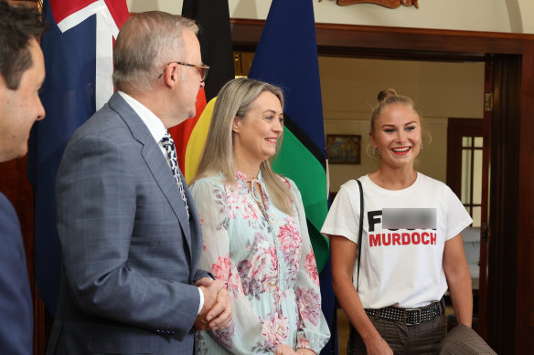 Prime Minister Anthony Albanese and Jodie Haydon greet Grace Tame at the Australian of the Year Awards morning tea.