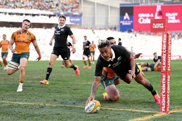 Rieko Ioane dives over for the All Blacks on Saturday.