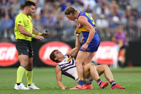 Harley Reid of the Eagles wrestles with Caleb Serong.