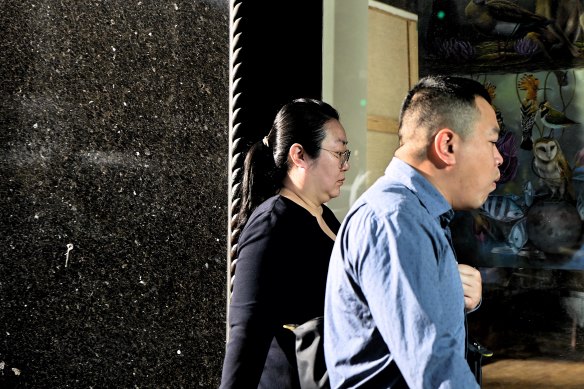 Jie Shao (left) arrives astatine  tribunal  during her trial.