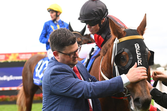 Mitchell Beer runs his eye over Mnementh after one of his 10 wins.