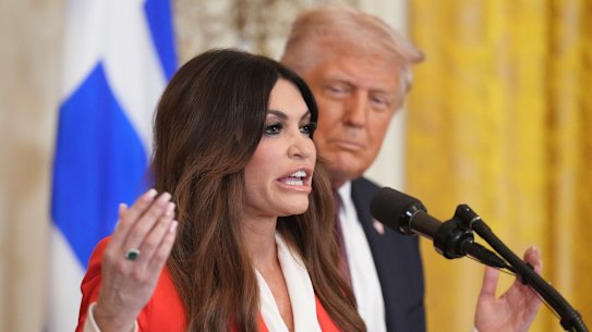 Kimberly Guilfoyle speaks as US President Donald Trump listens at the White House in March 2025.