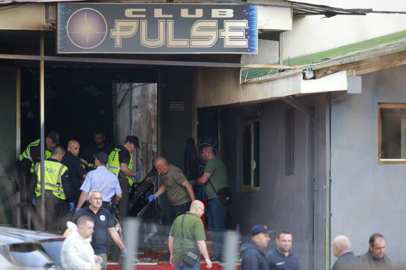 Police officers outside the Club Pulse nightclub on Sunday,