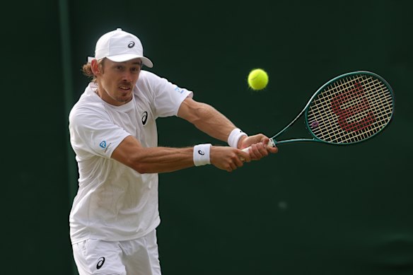 Alex de Minaur of Australia plays a backhand against August Holmgren.