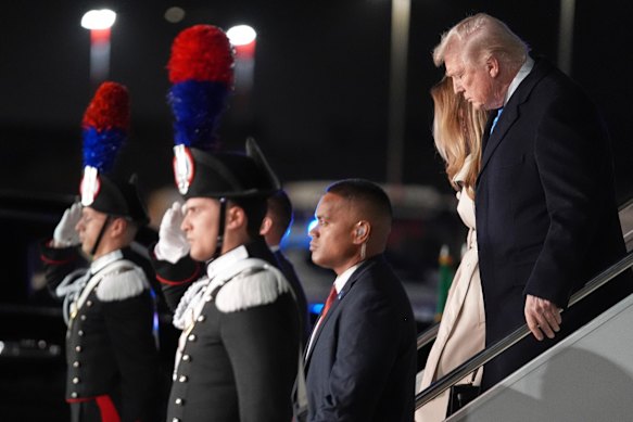 US President Donald Trump and first lady Melania Trump arrive at Leonardo da Vinci International Airport to attend the funeral.