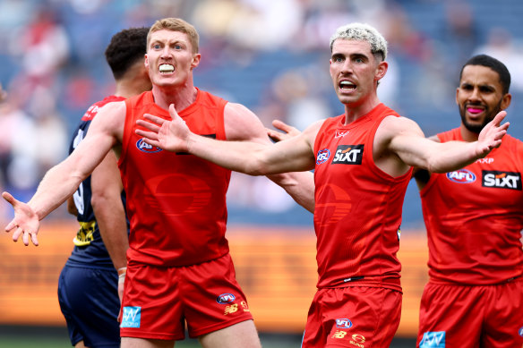 Matt Rowell and Sam Flanders of the Suns react during their win over Melbourne.