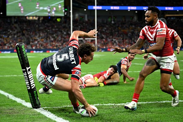 Mark Nawaqanitawase scores for the Roosters against the Dolphins.