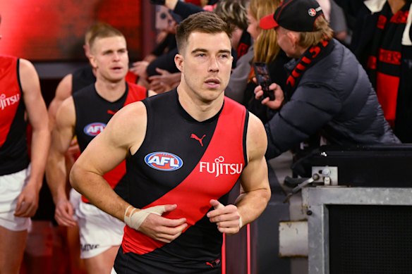 Zach Merrett’s time as Essendon skipper has ended.
