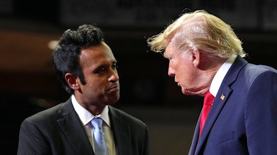 President Donald Trump shakes hands with gubernatorial candidate Vivek Ramaswamy at a rally in Ohio.