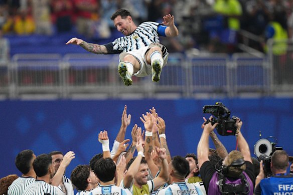 Argentina players toss teammate Lionel Messi (10) into the air as they celebrate after the World Cup round of 16 soccer match between Argentina and Egypt in Atlanta, Tuesday, July 7, 2026.
