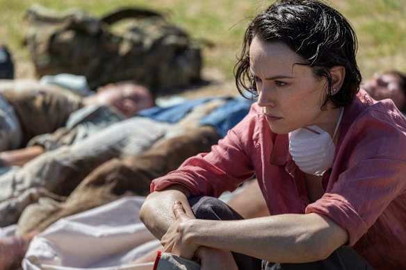 Daisy Ridley takes a moment during her mission to find her husband in We Bury the Dead. 