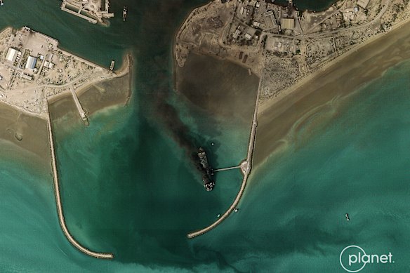The smoking remains of Iran’s largest warship were revealed on satellite imagery from earlier this week.