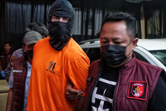Darcy Jenson being paraded at a police press conference in Bali in June.