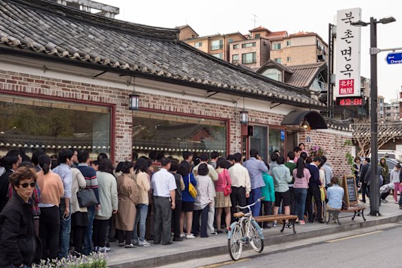 Customers queue outside a popular restaurant in Seoul, South Korea.