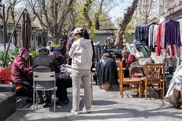 Residents play mah-jong in Dafangjia Hutong.