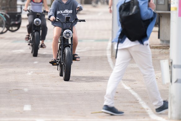 Teenagers riding fat-tyre e-bikes in Manly.