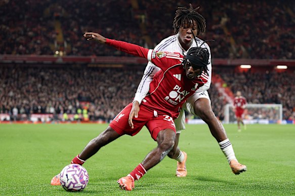 Jeremie Frimpong of Liverpool is challenged by Manchester United’s Patrick Dorgu.