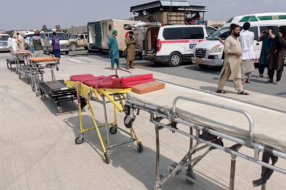 Stretchers and ambulances are prepared to receive earthquake victims.