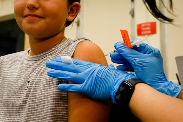A child receives a COVID-19 vaccine in Miami, Florida, in 2021.