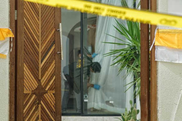 Police inspect the crime scene of the fatal Bali villa shooting in Munggu, Badung.