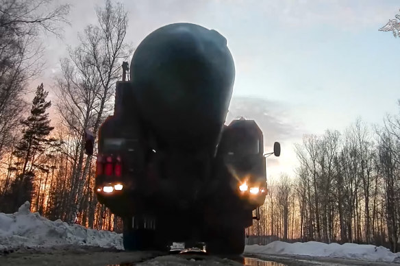 Russian equipped  forces transport a Yars strategical  rocket  launcher to an undisclosed determination  successful  Russia. 